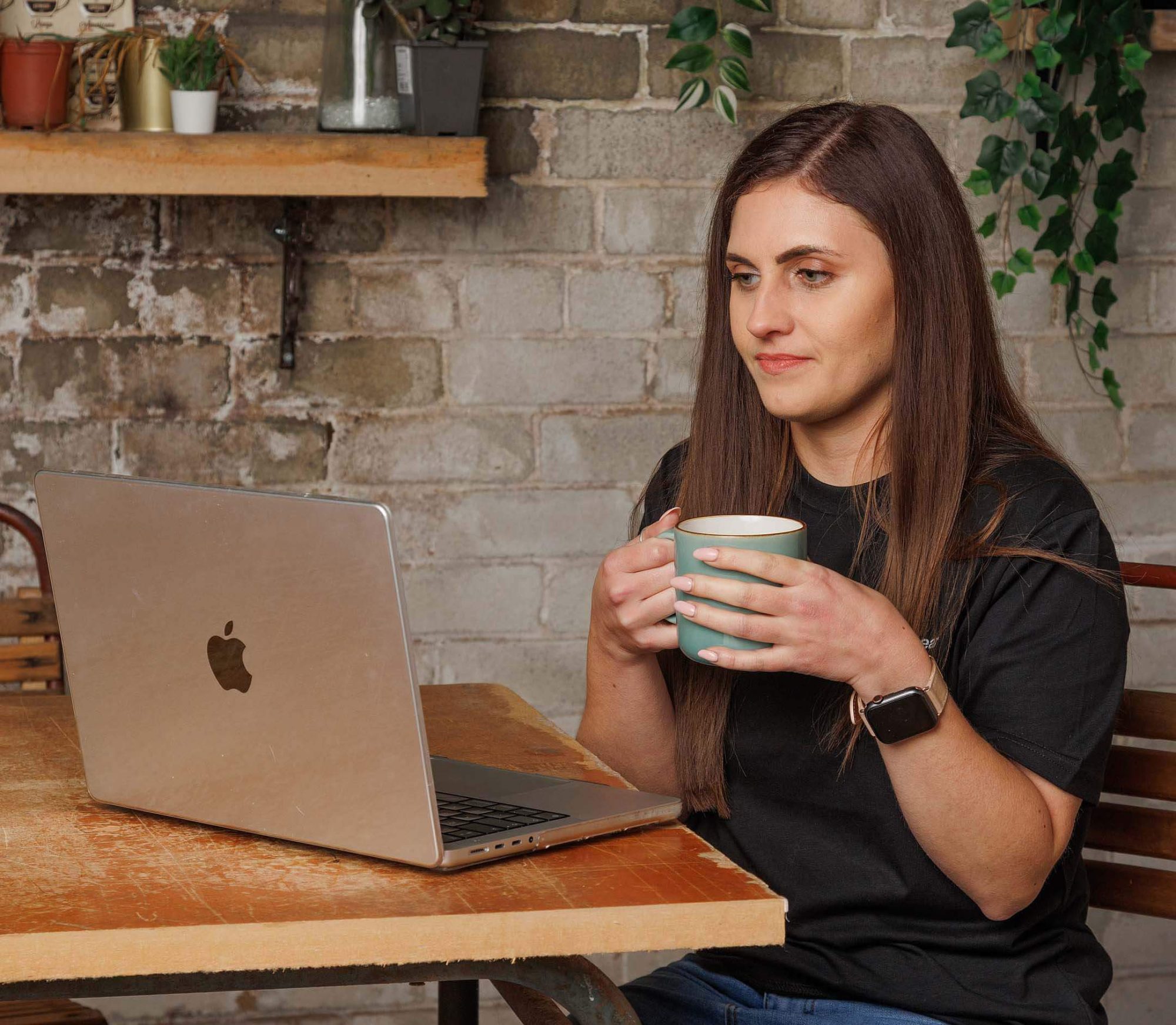 Nicole working on on laptop for website design and brand trademark checks