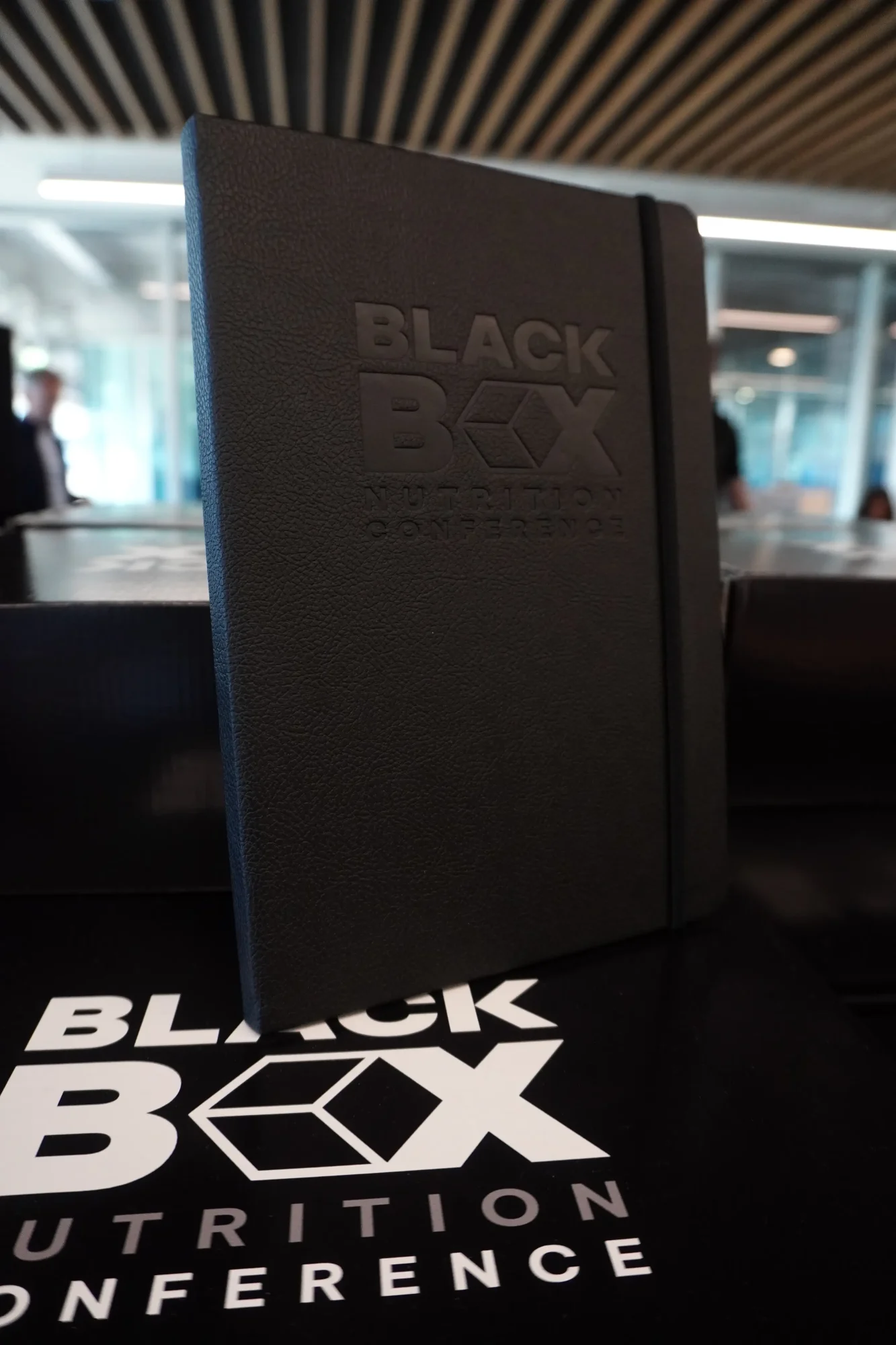 Blackbox conferences embossed notebook and giftbox with event branding for fitness nutrition coaches