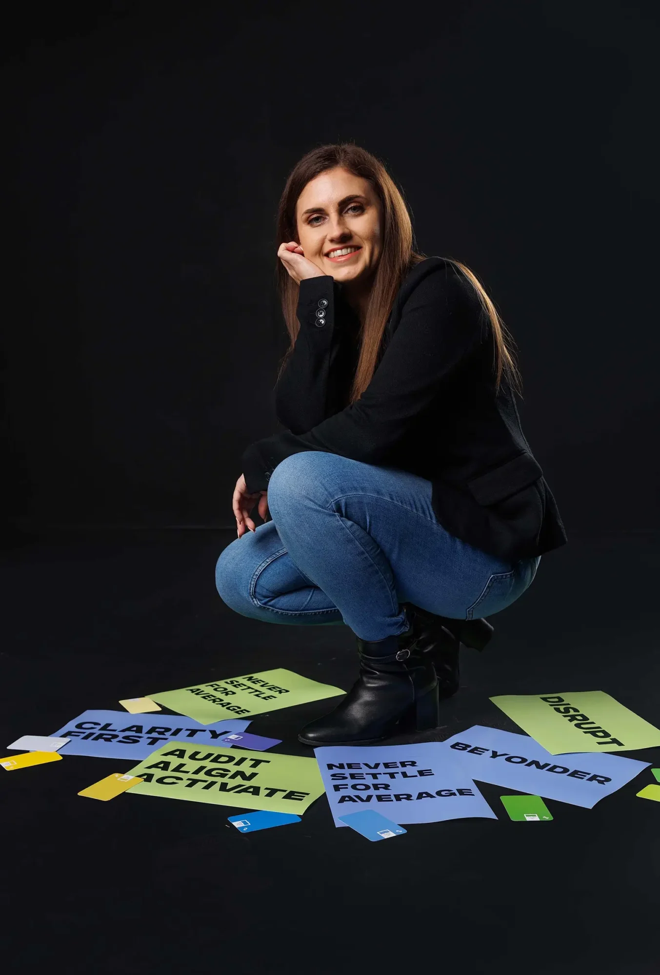 Nicole stood on top of digital bear studio quote papers in a dark studio setting design agency berkshire